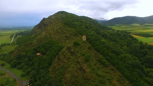 Aerial view of old Gremi tower standing on hill in Georgia, ancient architecture