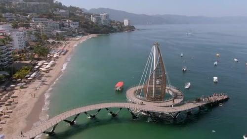Playa De Los Muertos Beach And Pier Close To Puerto Vallarta Malecon In Mexico - aerial drone shot
