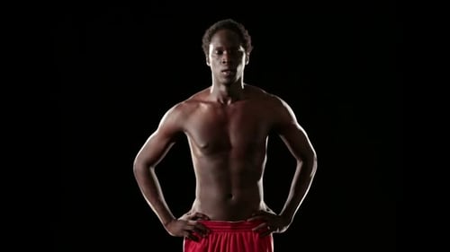 Toned Athletic Man Against Black Backdrop