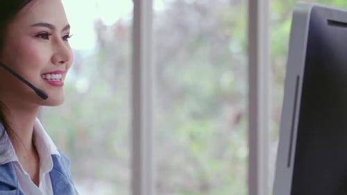 Customer Support Agent or Call Center with Headset Talking to Customer on Phone