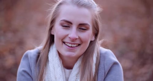 Blonde Woman Smiling in Nature Close Up