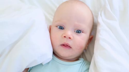 Funny Infant Face Portrait Blue Eyes Happy Smiling Baby Child 3 Months on White