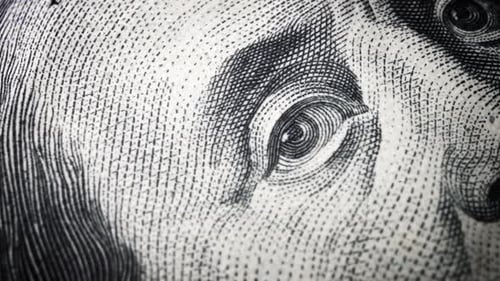 American one hundred dollar paper banknote in close up macro view dolly shot.