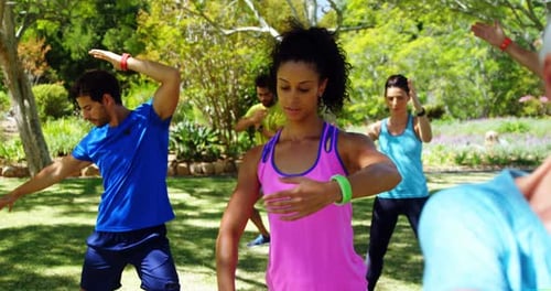 Group of people exercising in the park 4k