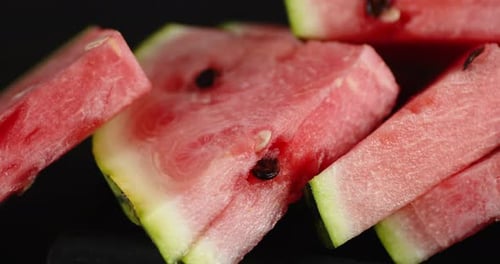 Sliced Ripe Watermelon on the Table Slowly Rotates.