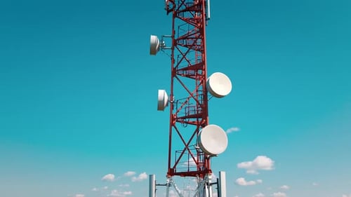 Aerial View of 4G and 5G Cell Tower with Antennas and Satellites