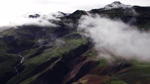 Mountainous Aerial Landscape Shrouded in Clouds