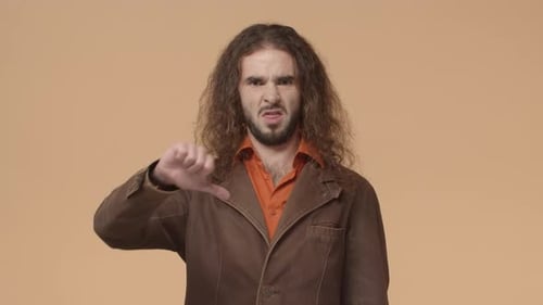 Man Giving Thumbs Down Gesture of Disapproval