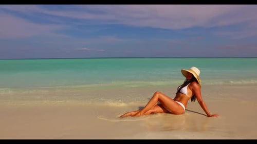 One girl relaxing on relaxing resort beach holiday by clear ocean with white sandy background of the