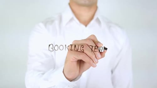 Writing Booking Terms on Clear Surface