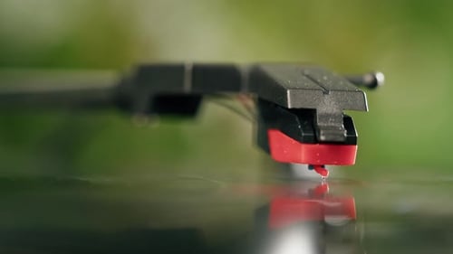 Phonograph Needle Plays Black Vinyl Record