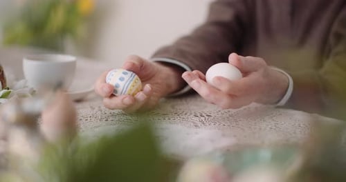 Senior Man Holding Easter Eggs in Hands