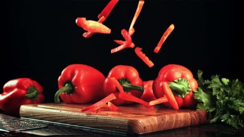Chopped Bell Pepper Falling on Cutting Board
