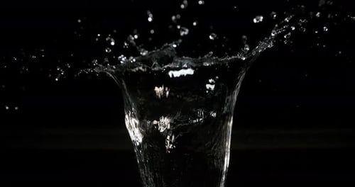 Dramatic Water Splash on Black Background in Slow Motion
