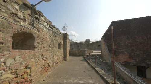 A stone fortress wall with windows