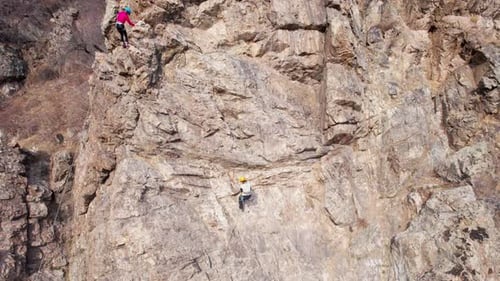 Rock Climbing Training on Steep Slope in Mountains