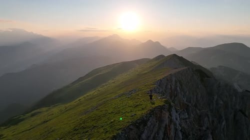 Aerial hikers in the Dolomites mountains at sunrise