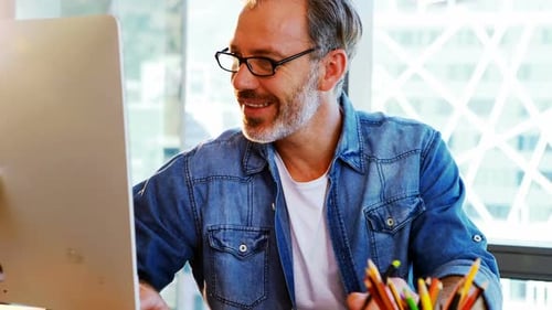 Man Working at Computer in Modern Office