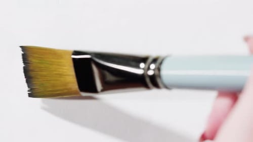 Brush Painting with Red Color Closeup Art Concept