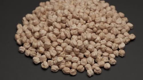 Pile of Dried Chickpeas on Black Background