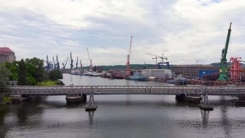 Aerial View of Shipyard Construction With Towering Cranes