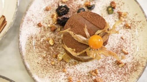 Elegant Chocolate Dessert with Golden Berry Garnish
