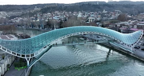 Aerial view of Tbilisi city central park and Bridge of Peace. Beautiful cityscape of old Tbilisi