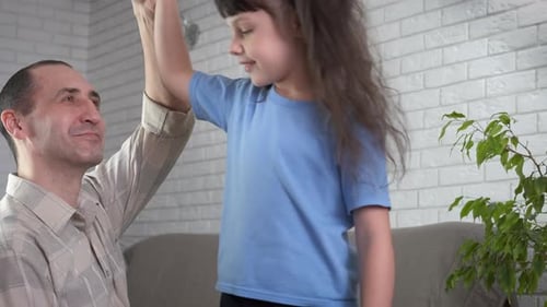 Loving Father and Child Playing Hand Game