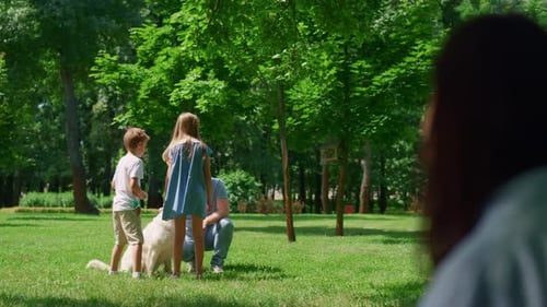 Father with Children and Dog in Green Park