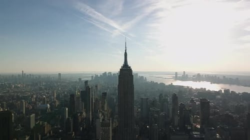 Aerial View of Empire State Building Towering High Above Surrounding Development
