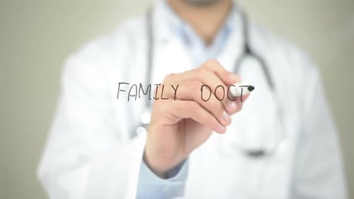 Doctor Writes Family Doctor on Transparent Surface