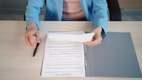 Close Up Business Woman Works with Documents