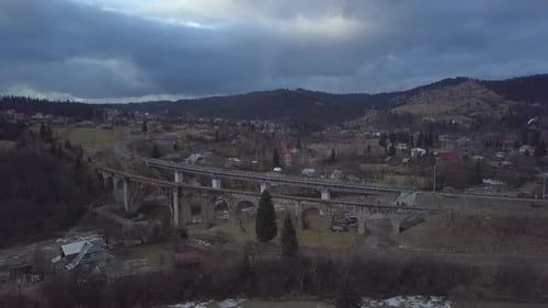 Flight Over the Village in the Carpathian Mountains