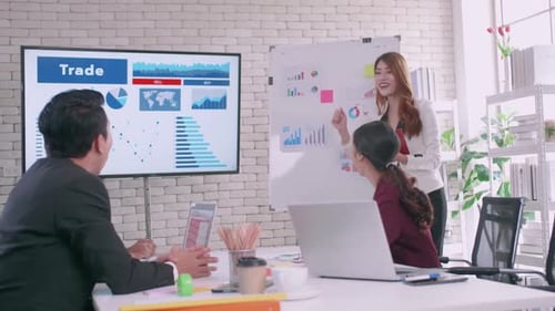 Cheerful Young Adults in a Successful Business Meeting