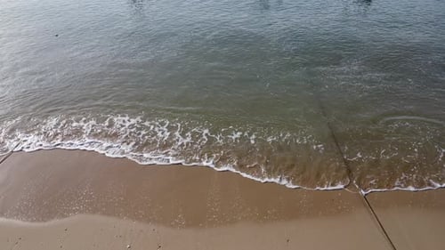 Aerial view from drones of fishing boats in the shore during low tide.