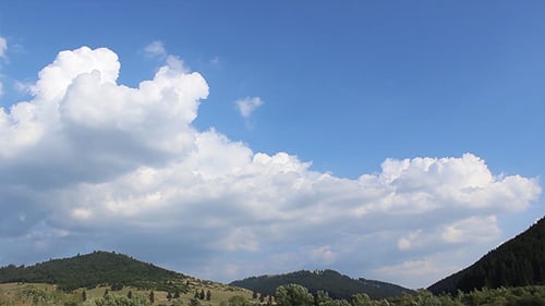 Clouds Shaping Over Forested Hills
