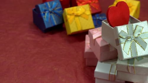 Colorful Gifts and Hearts on Red Background