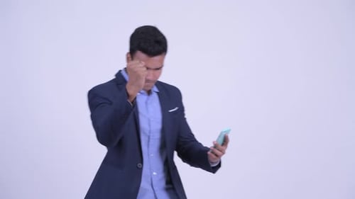 Excited Businessman Using Mobile Phone