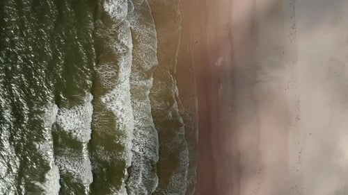 Aerial Birds Eye Overhead Top Down View of Waves Rolling on Coast