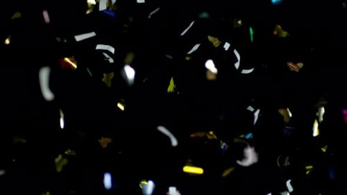 Confetti Falling on a Black Background