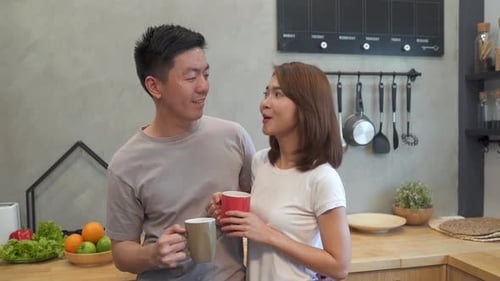 Loving Couple Enjoying Coffee Together in Modern Kitchen