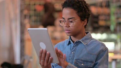 Woman Uses Tablet in Modern Indoor Environment