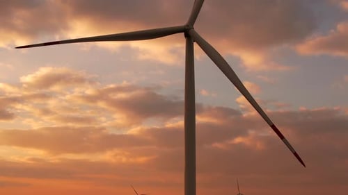 Wind Turbines Turning Silently at Colorful Sunset