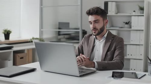 Businessman Video Calling on Office