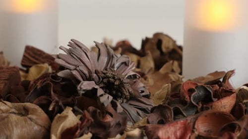 Close Up of Potpourri and Glowing Candles