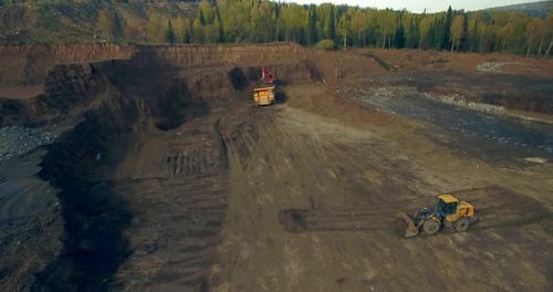 Aerial View Excavator Loads Tipper Truck