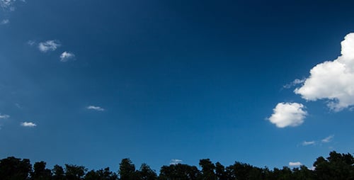 Clouds Time-Lapse Over Green Trees on a Sunny Day