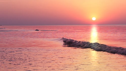 Beautiful Golden Sunrise Over the Calm Ocean