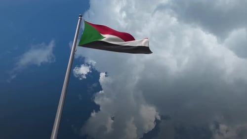 Realistic Sudan Flag Waving in Blue Sky with Clouds