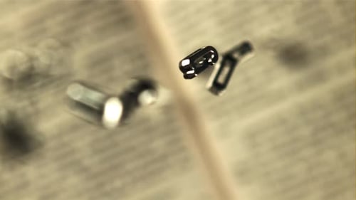 Metal English Letters Fall on the Open Book